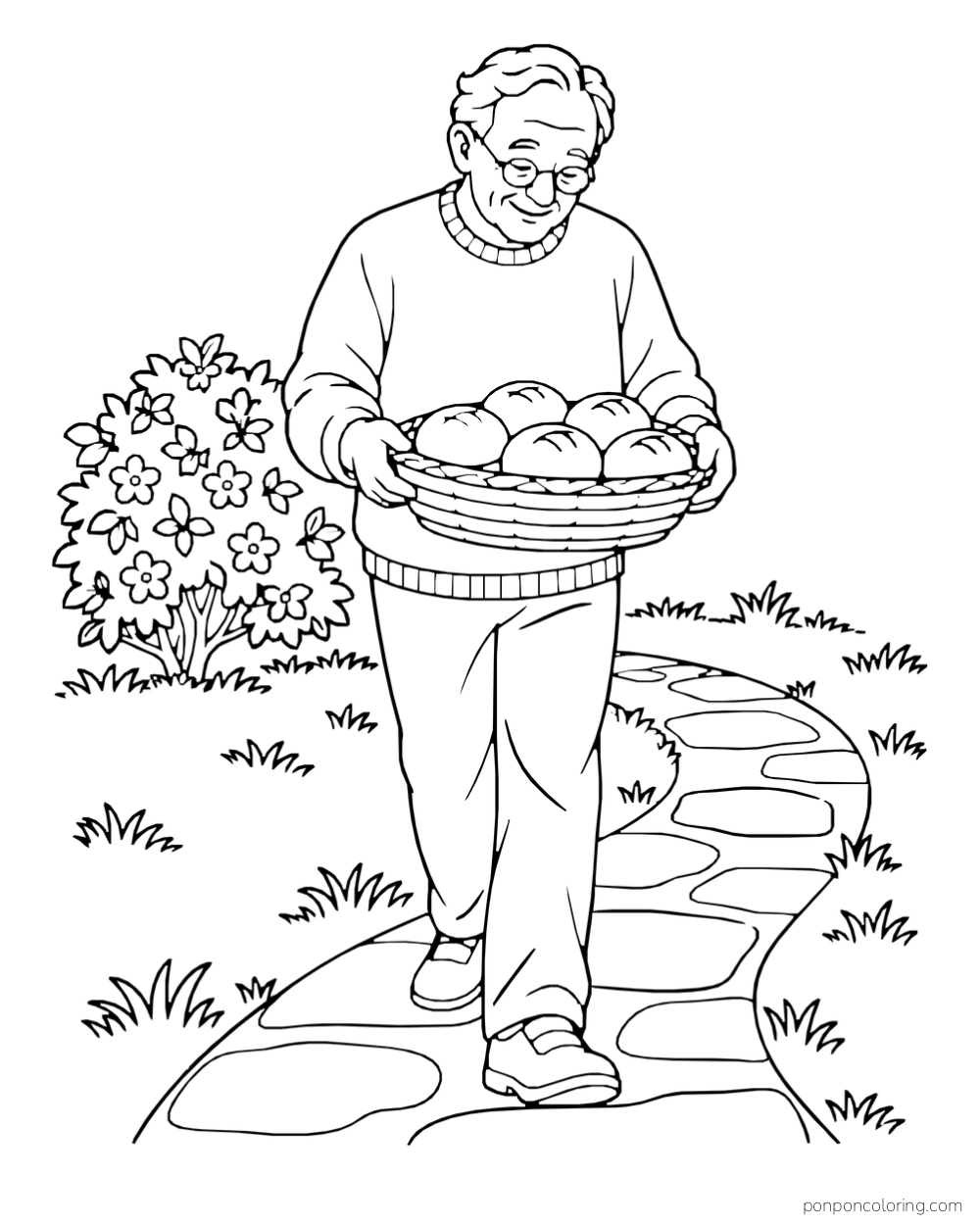 An older man carries a wide basket of bread rolls along a stone path beside flowering bushes.