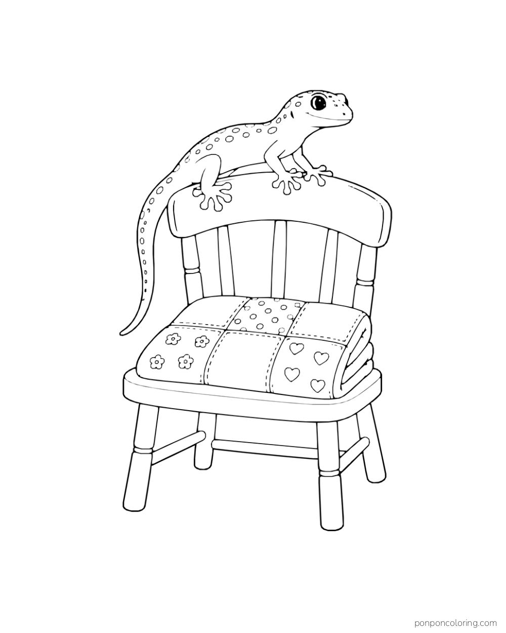 A gecko rests on the curved back of a chair with a folded patchwork quilt on its seat.