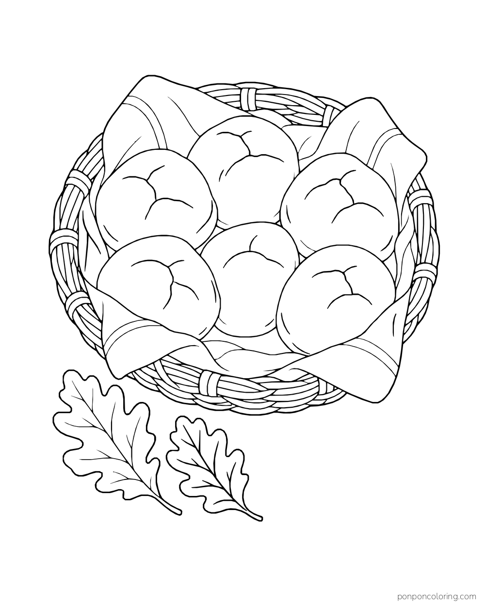 Six rolls nestle in a cloth-lined basket beside two oak leaves.