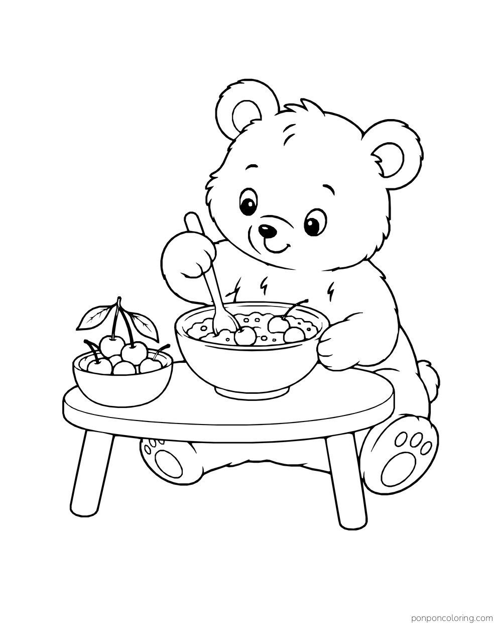 A bear cub stirs a bowl of cherries at a low table, with a second fruit bowl nearby.