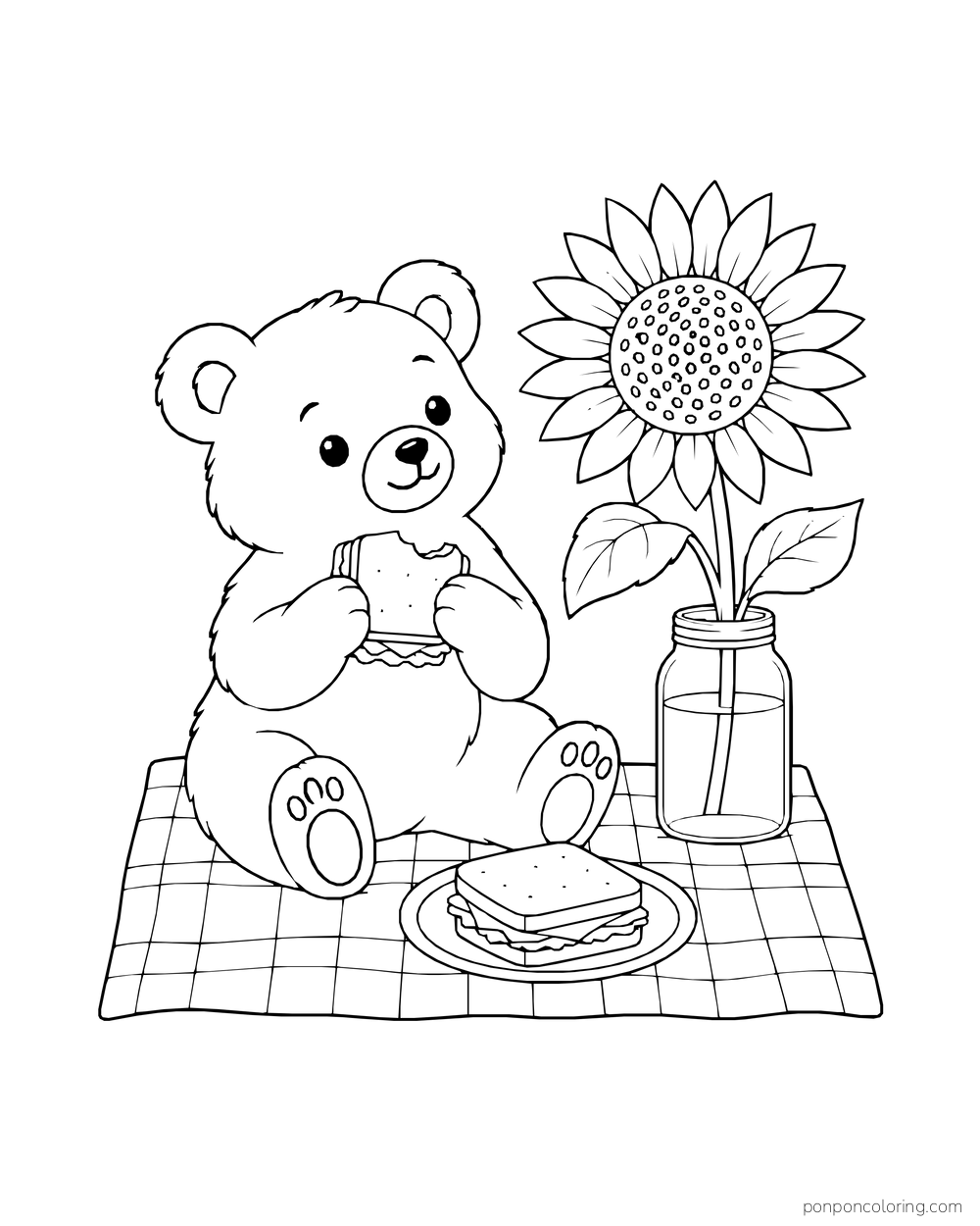 A bear on a checked picnic blanket beside a sunflower in a jar and sandwiches.