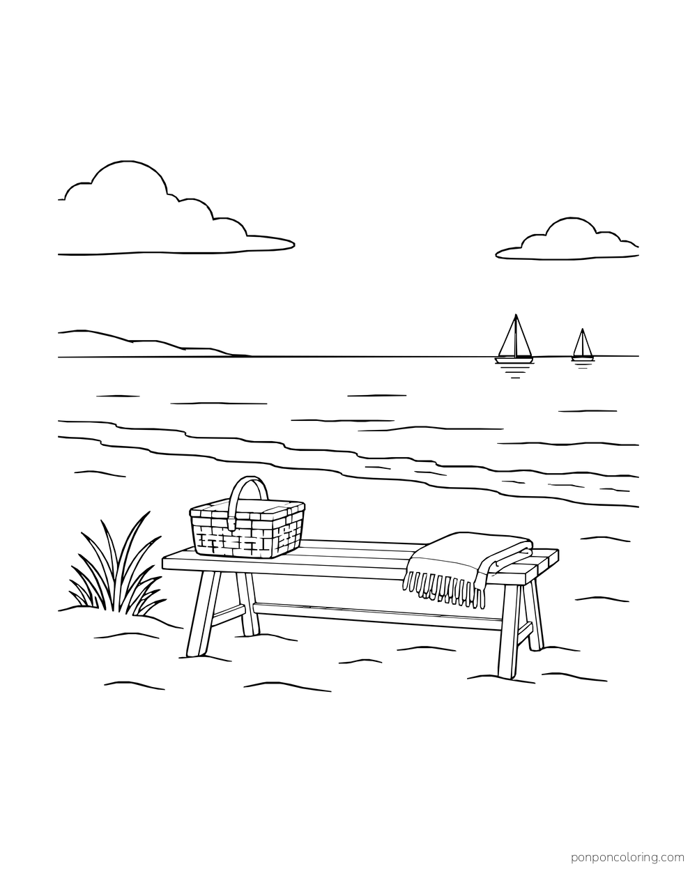 A beach bench holds a basket and folded blanket as sailboats pass in the distance.