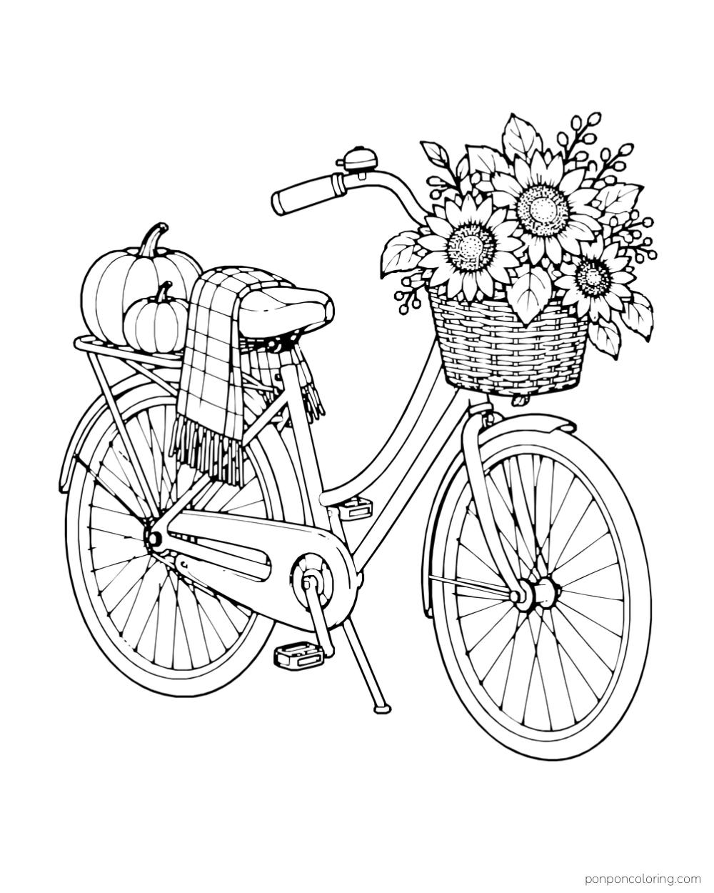 A bicycle carries a basket of sunflowers, a pumpkin, and a checked blanket.