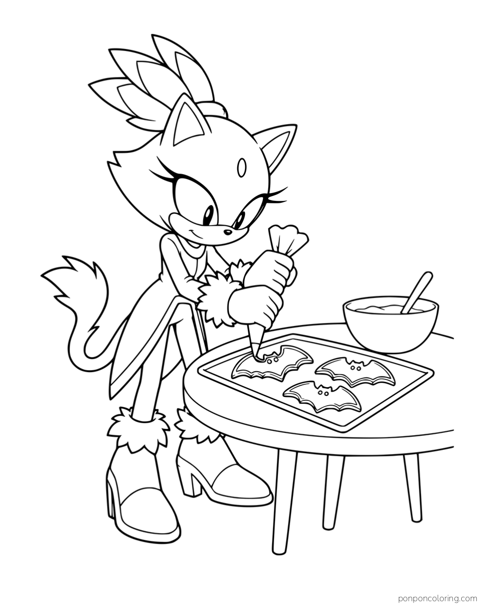 Blaze decorating bat-shaped cookies on a tray.