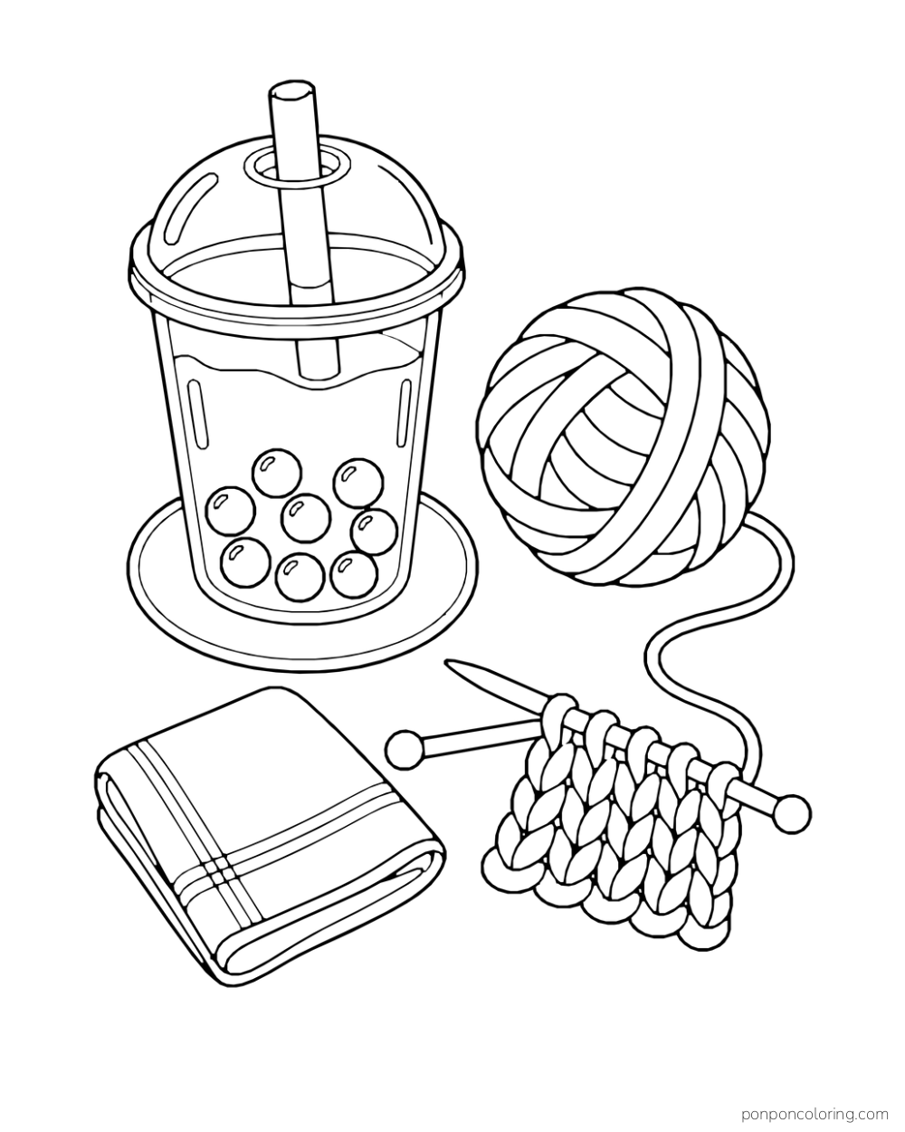 Overhead view of a boba cup, ball of yarn, knitting needles, and folded cloth.