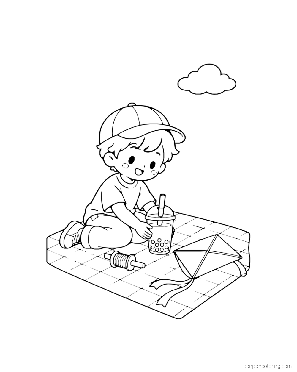 A child kneels on a checked blanket beside a boba cup and a kite lying on the ground.