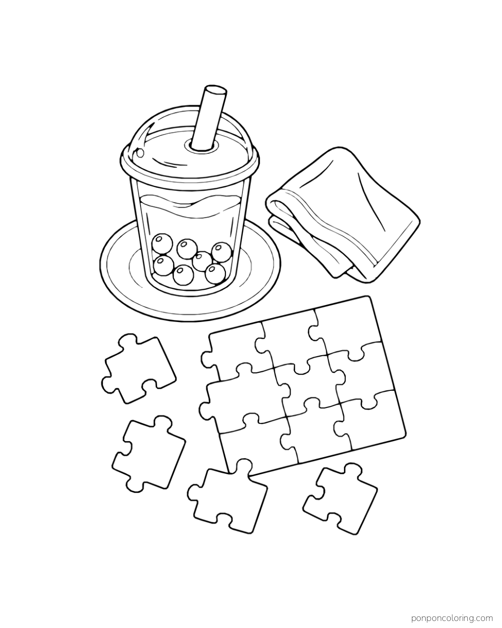 A boba cup on a saucer rests near loose puzzle pieces and a folded napkin.