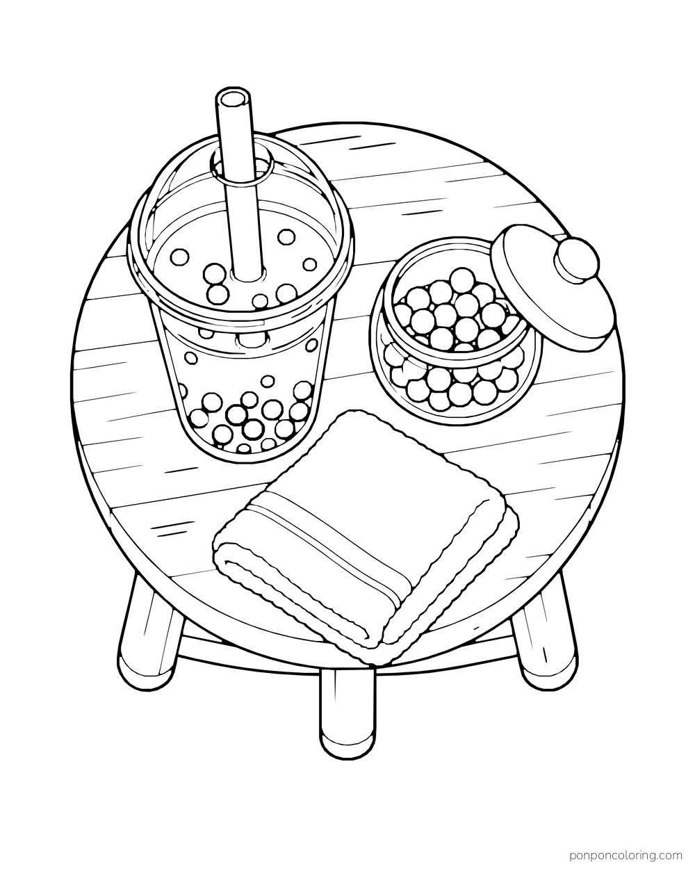 Overhead view of a boba cup, open pearl jar, and folded cloth on a round stool.