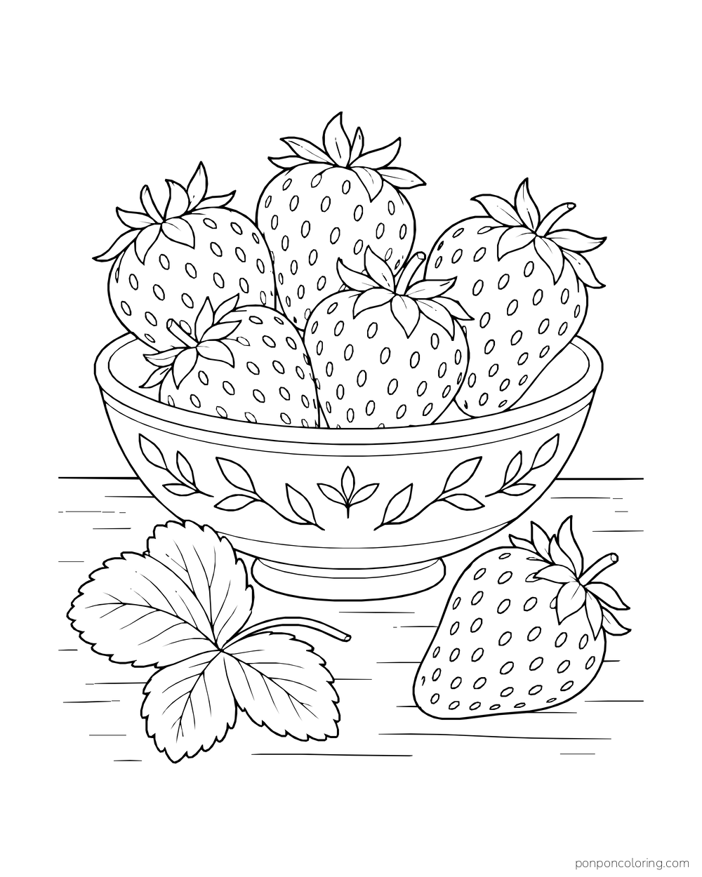 A decorative bowl holds several large strawberries, with one berry and leaves on the table beside it.