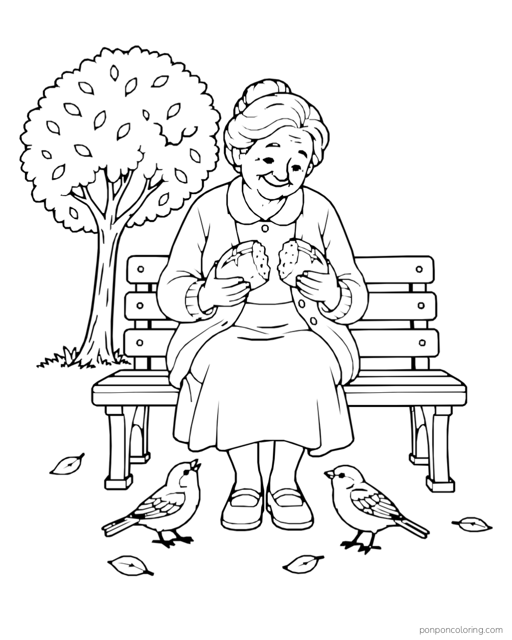 An older woman holds two halves of a bread roll on a park bench while two birds stand nearby.