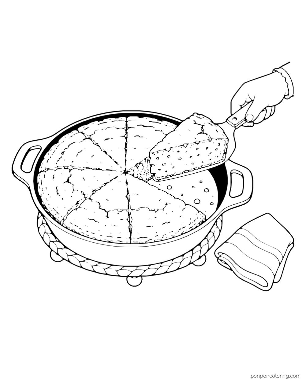 One bread wedge is lifted from a round skillet on a trivet beside a folded cloth.