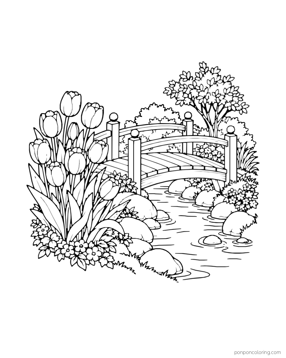 A little wooden bridge over a stream with tulips and rocks on one bank.