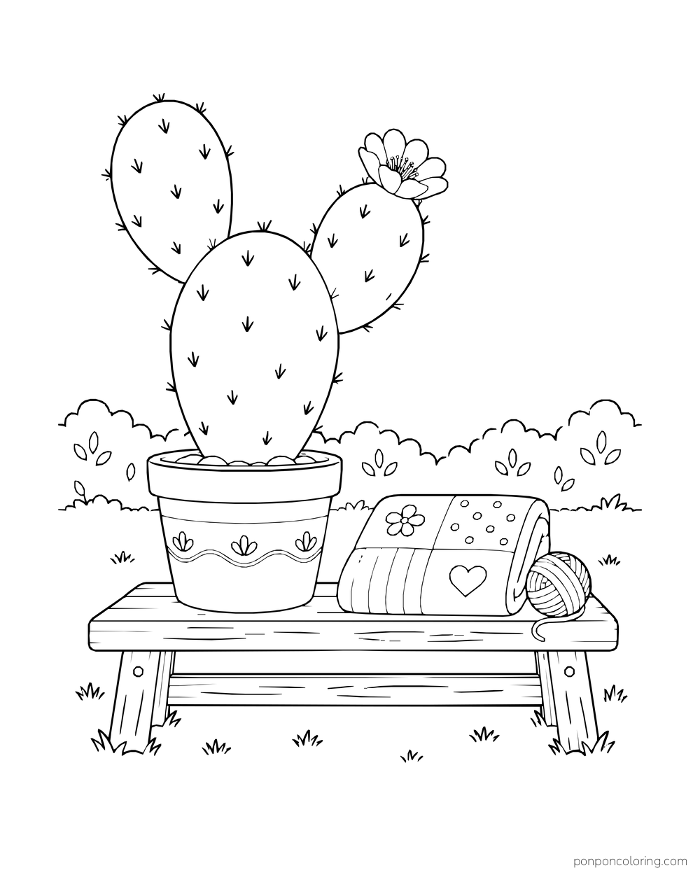 A potted bunny-ear cactus sits on a wooden bench beside a folded patterned quilt and yarn.