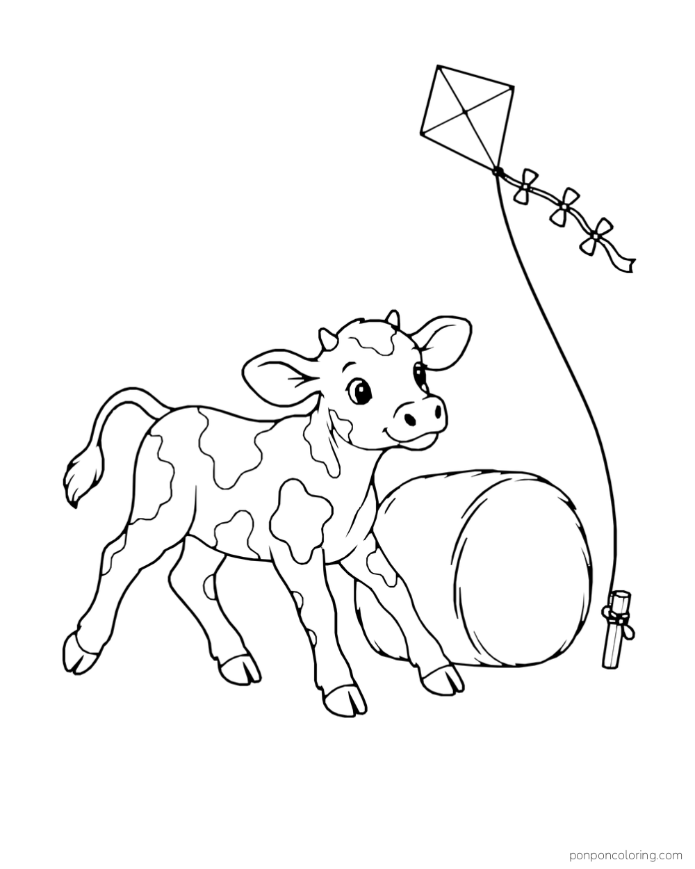 A calf stands beside a hay bale while a kite flies above.