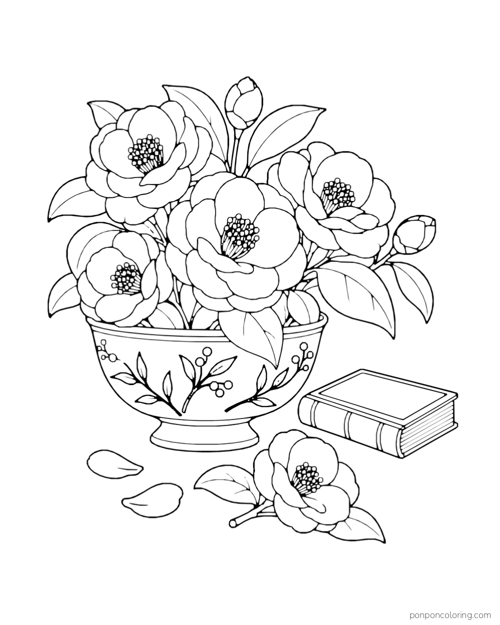 A patterned bowl of camellia flowers sits beside a closed book, fallen petals, and a cut blossom.