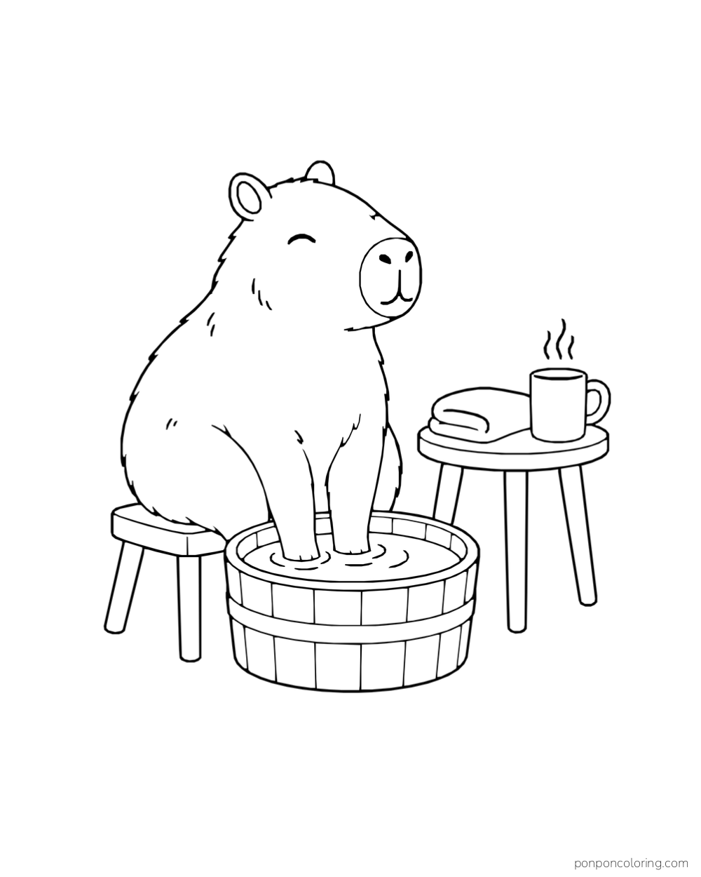 A capybara sits on a stool with its front paws in a wooden tub beside a folded towel and mug on a table.