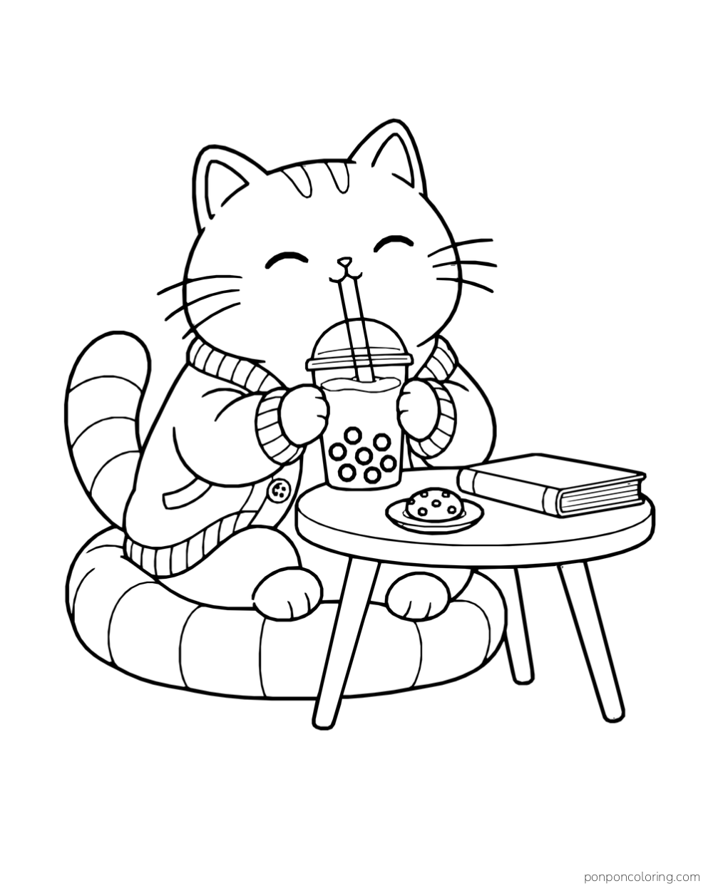 A cat in a cardigan sits on a round cushion sipping boba tea beside a table with a closed book and a cookie.