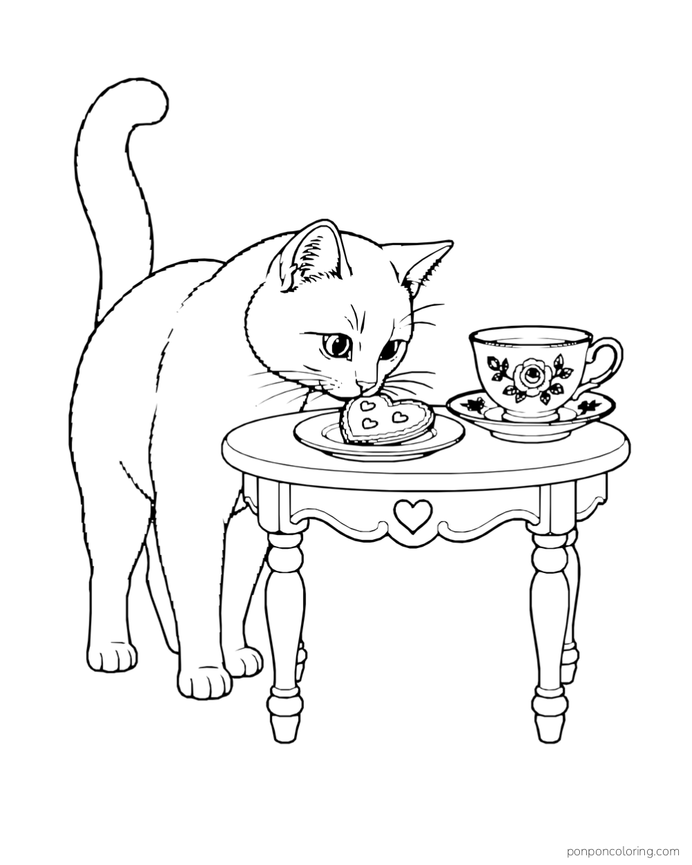 A cat sniffs a heart-shaped cookie on a small table beside a floral teacup.