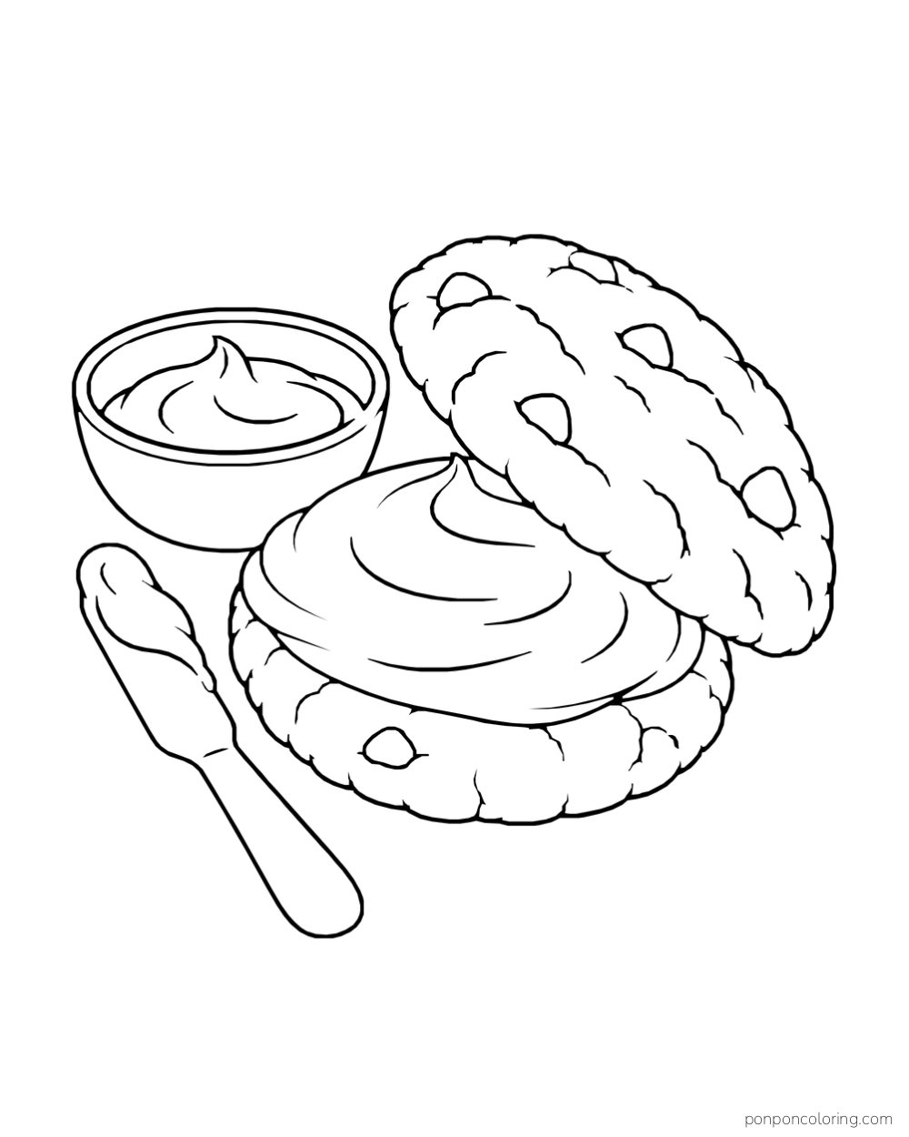 A large sandwich cookie is opened to show a swirl of filling beside a bowl and spoon.