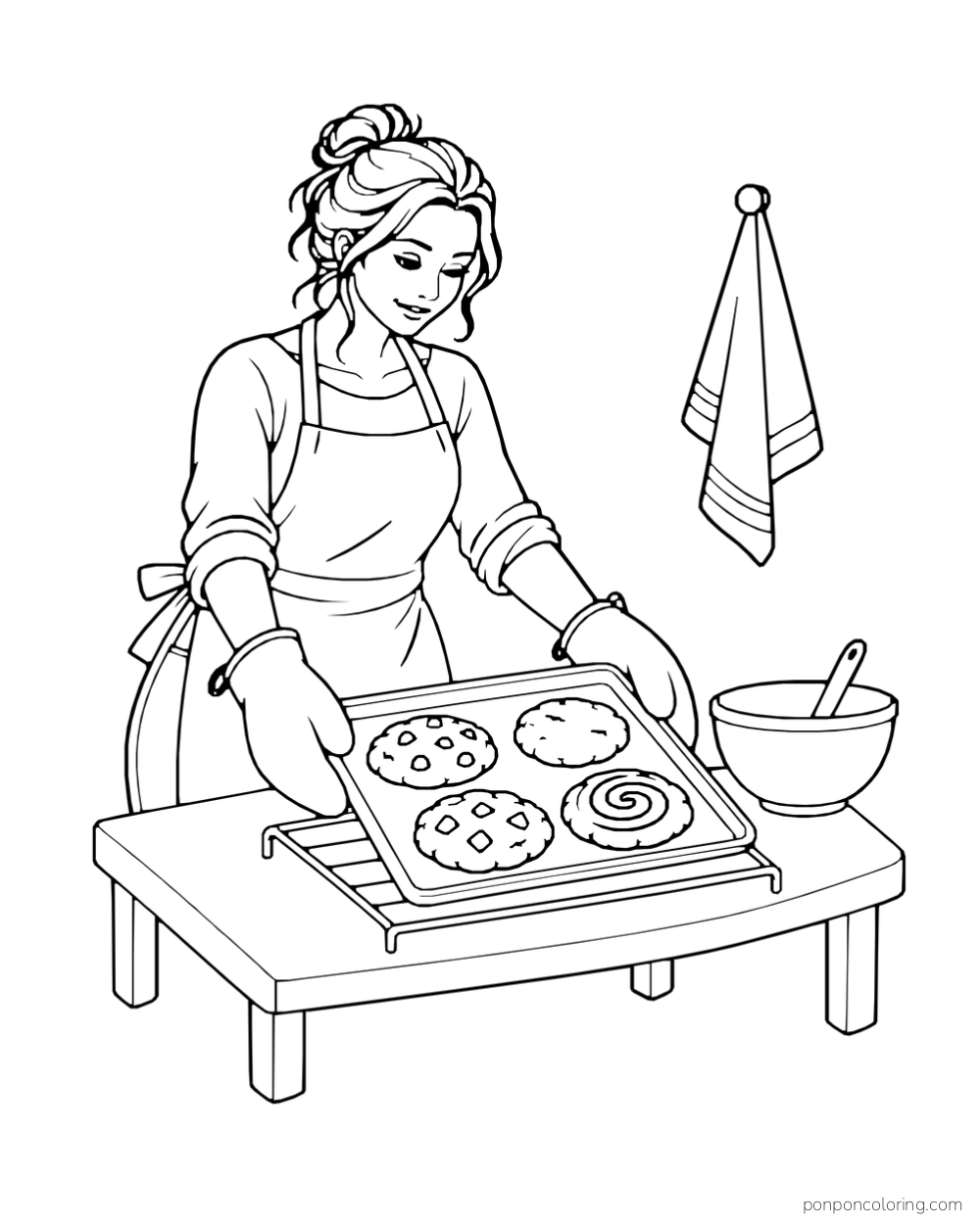 A baker sets a tray of four cookies onto a cooling rack beside a mixing bowl.
