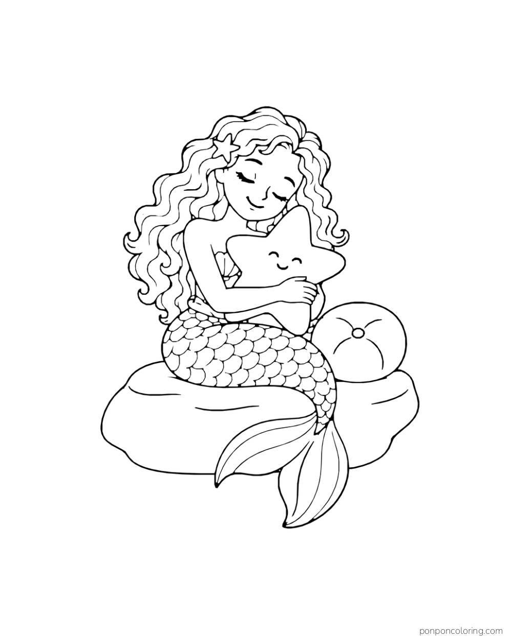 A curly-haired mermaid holds a round cushion in a nook edged with large smooth pebbles.