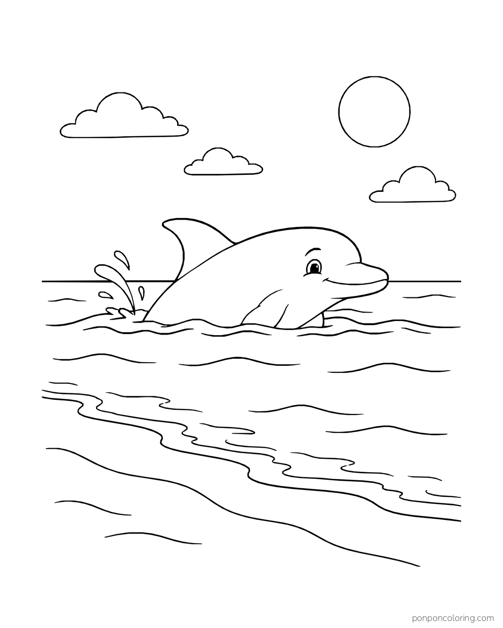 A dolphin rises from calm water with a sandy beach behind it.