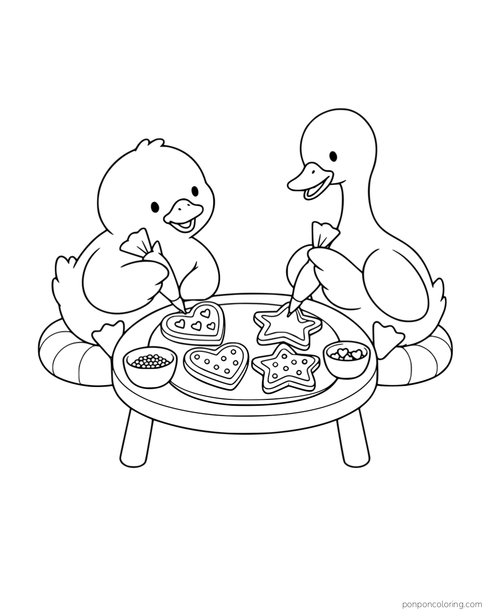 Two ducks decorating heart and star cookies at a low round table.