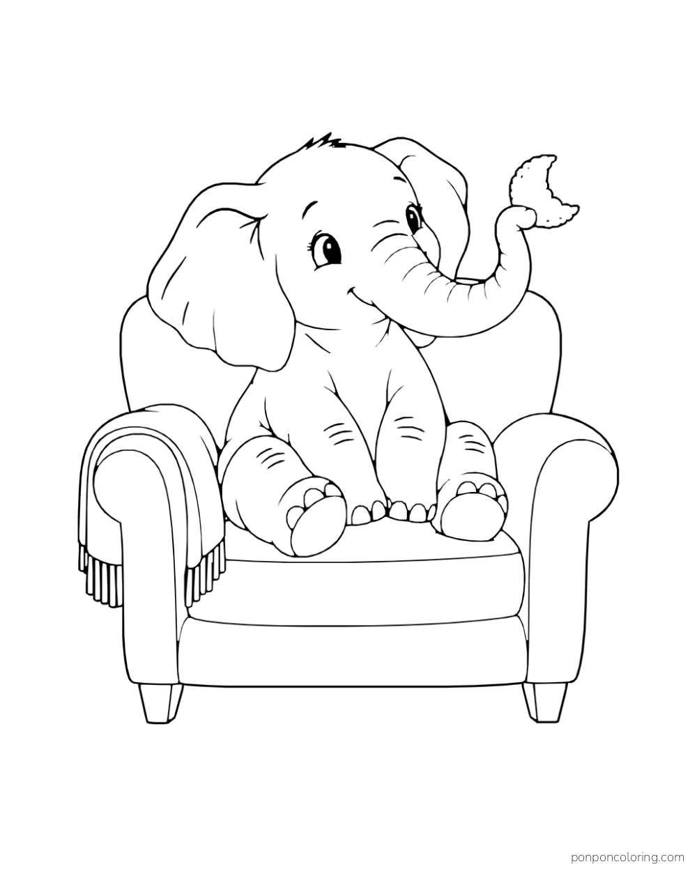 A small elephant sits in an armchair and holds a crescent cookie with its curled trunk.