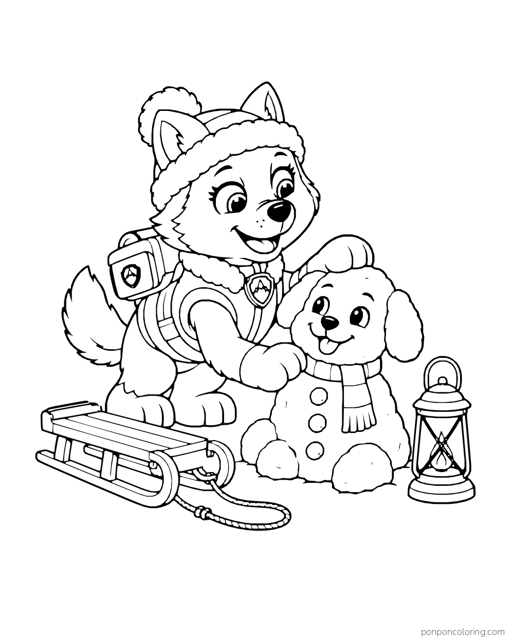 Everest makes a snow puppy beside a sled and a lantern.