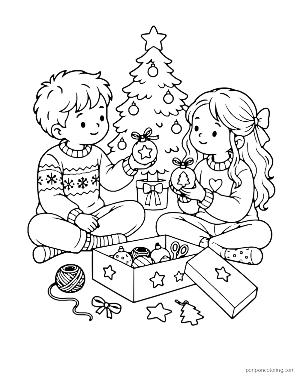 Two children exchange decorated ornaments beside a Christmas tree and a box of craft supplies.