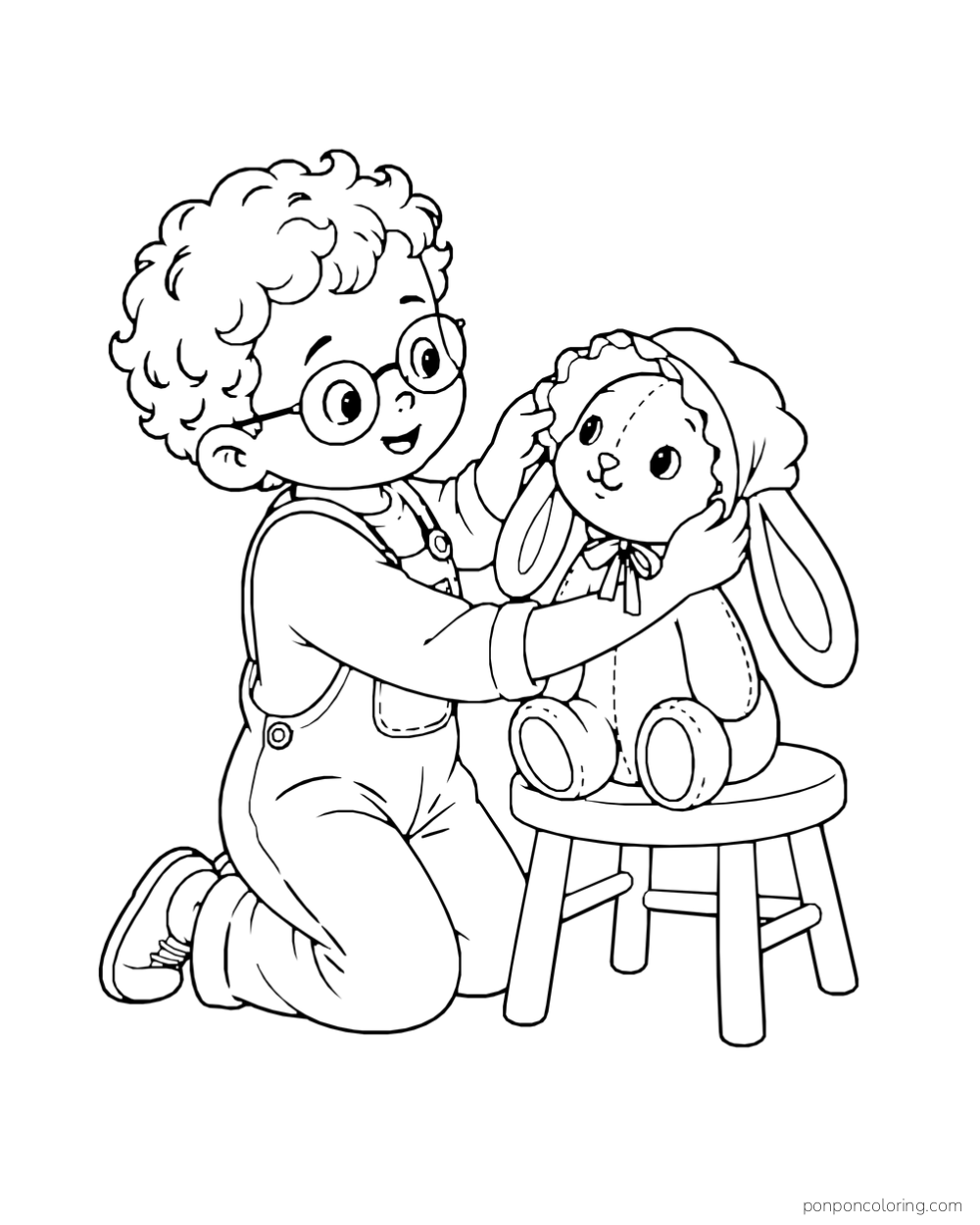 A boy with curly hair and round glasses puts an Easter bonnet on a stuffed rabbit sitting on a stool.