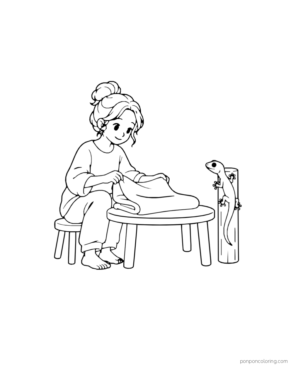 An adult folds a blanket at a small table while a gecko clings to a short wooden post nearby.