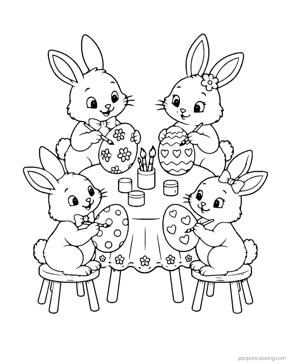 Four rabbits decorate eggs with flowers, hearts and dots around a table with paint pots and brushes.