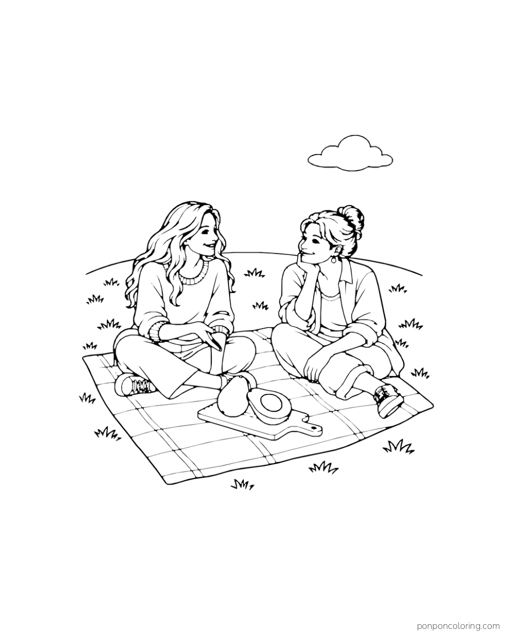 Two adult friends sit on a picnic blanket at an overlook, with one whole avocado and one avocado half on a serving board.