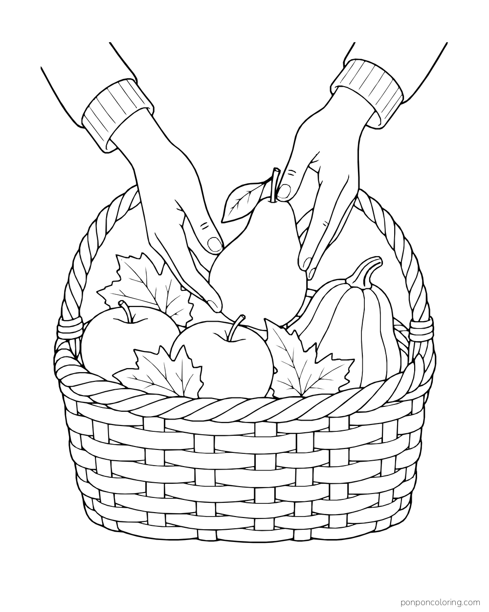 Two hands lower a pear into a basket with apples, squash and leaves.