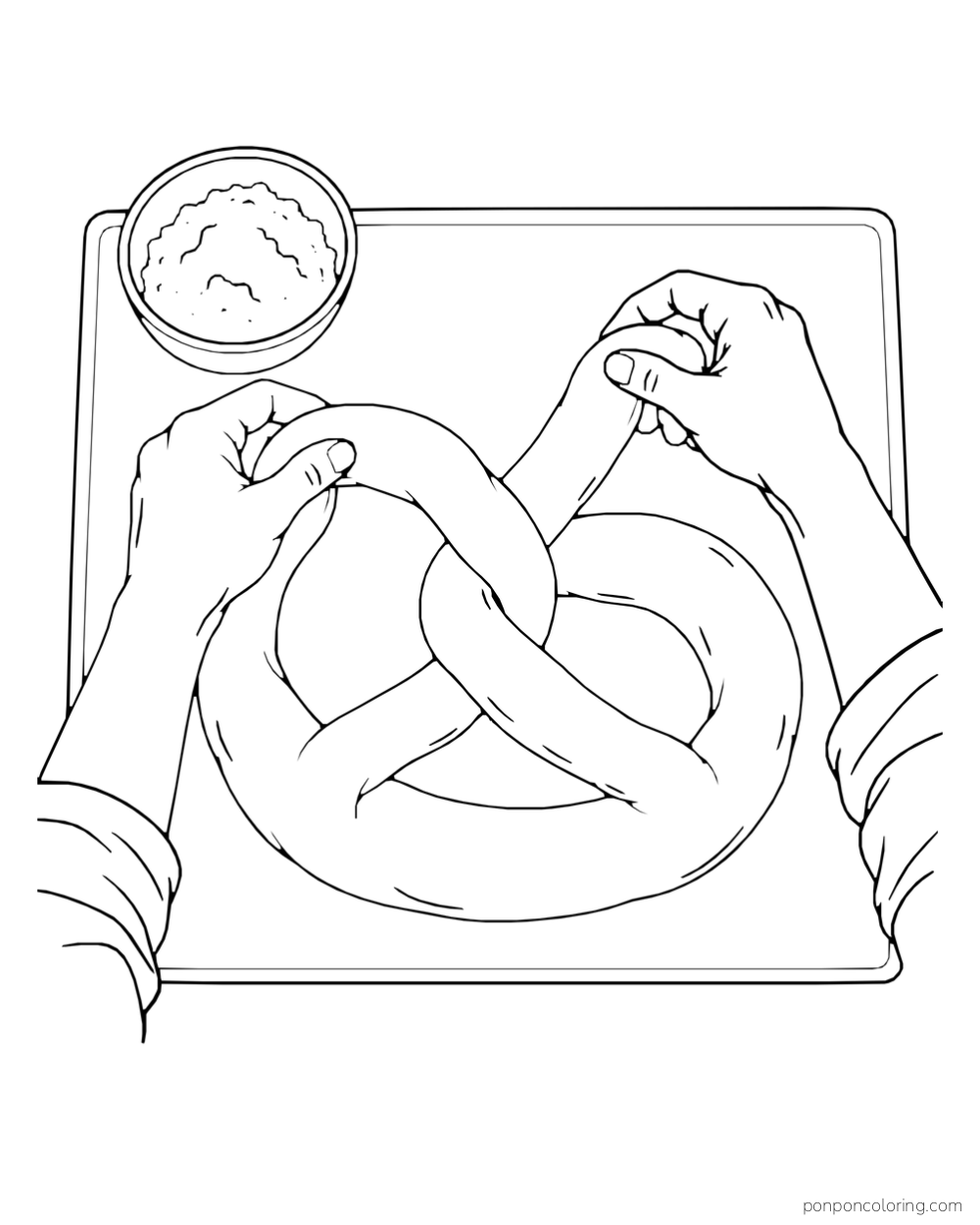 Two hands shape a thick rope of dough into a pretzel on a board beside a bowl of flour.