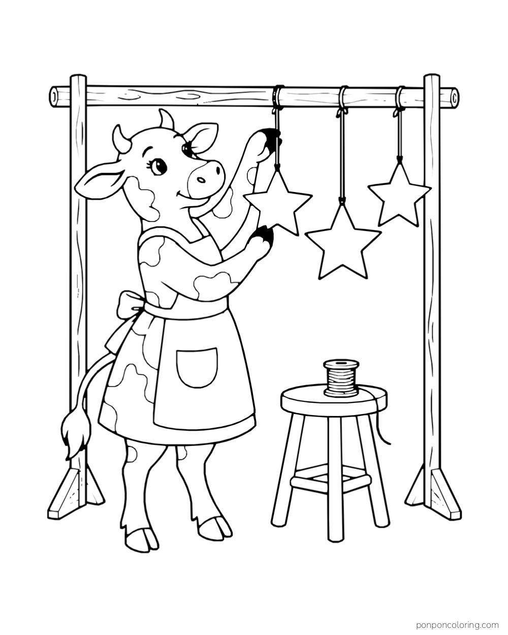 A cow in an apron hangs three paper stars from a wooden rail.