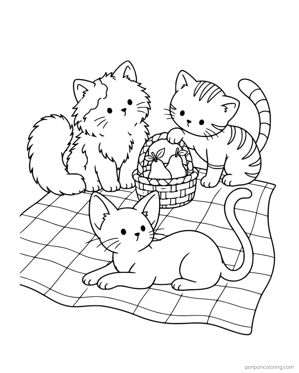 Three kittens with different fur and markings gathered around a picnic basket on a quilt.