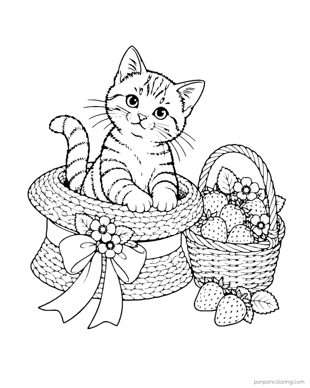 A kitten sits inside a straw hat beside a basket of strawberries.