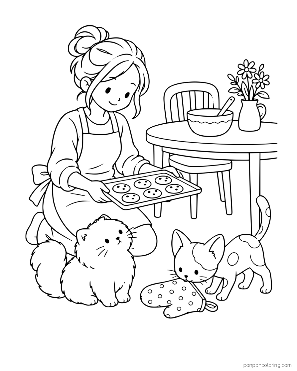 A woman holding a cookie tray beside two different kittens, an oven mitt and a small kitchen table.