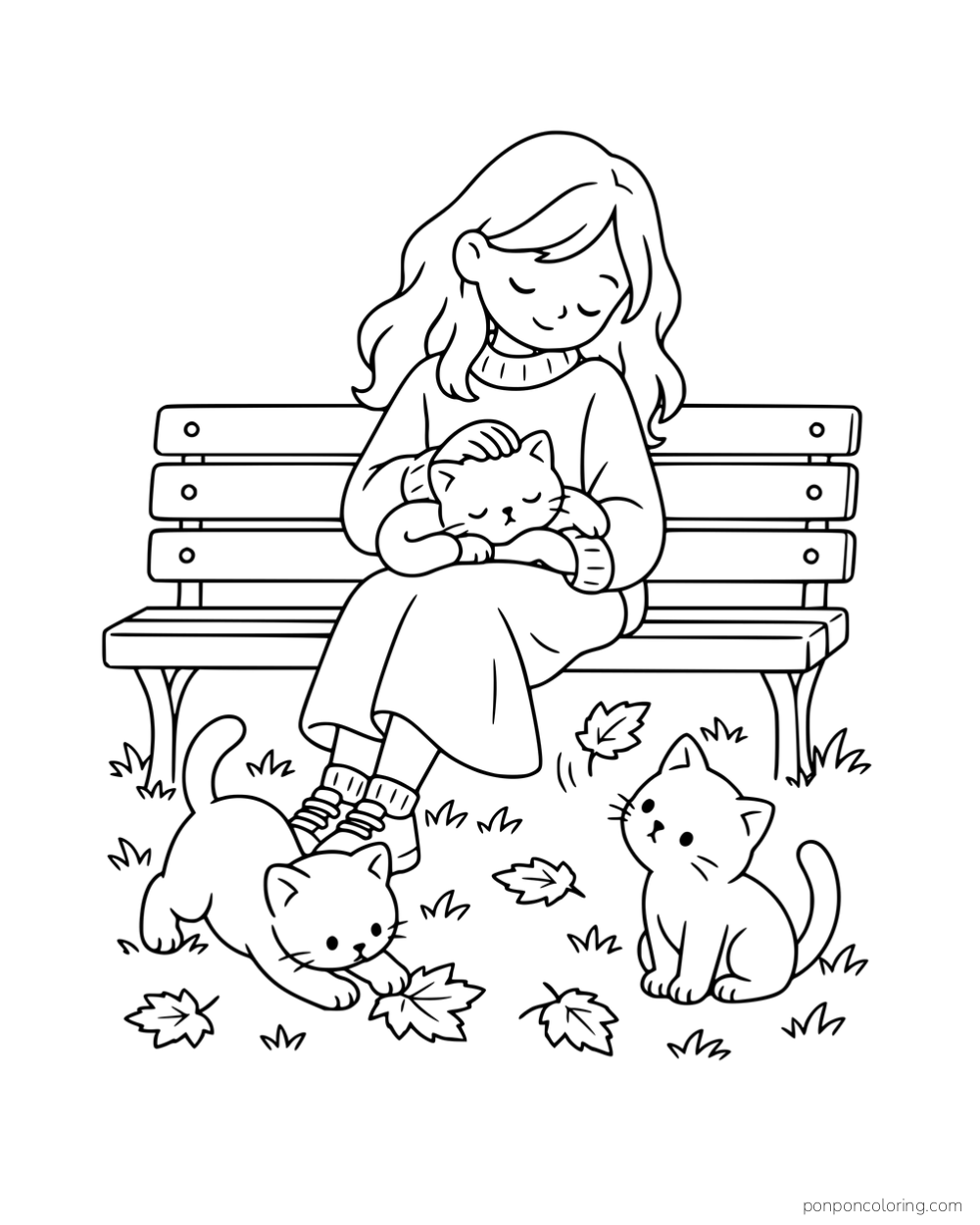 A woman stroking a kitten on a park bench while two kittens watch and play with fallen leaves.