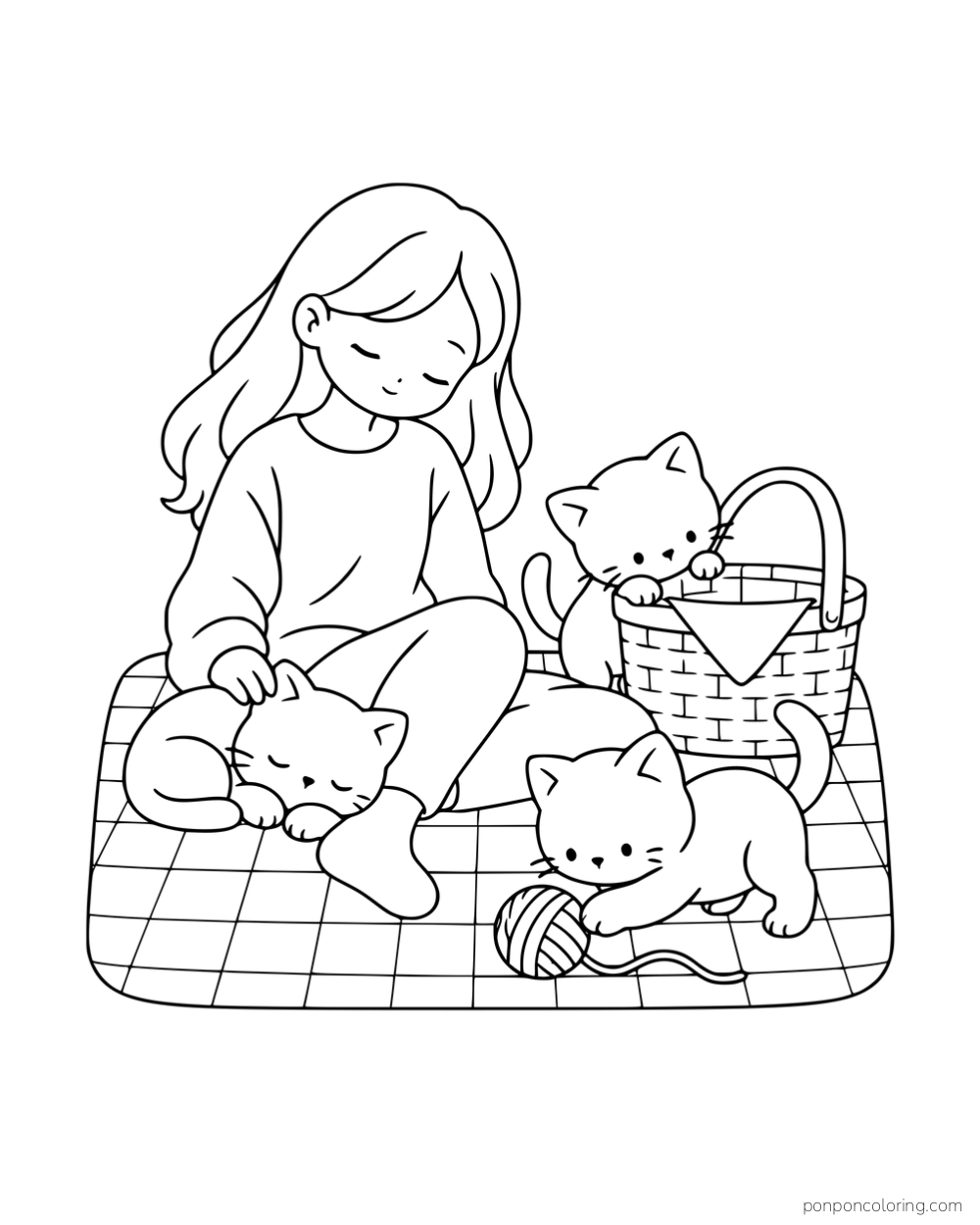 A woman sitting on a picnic blanket with three kittens, a basket and a ball of yarn.