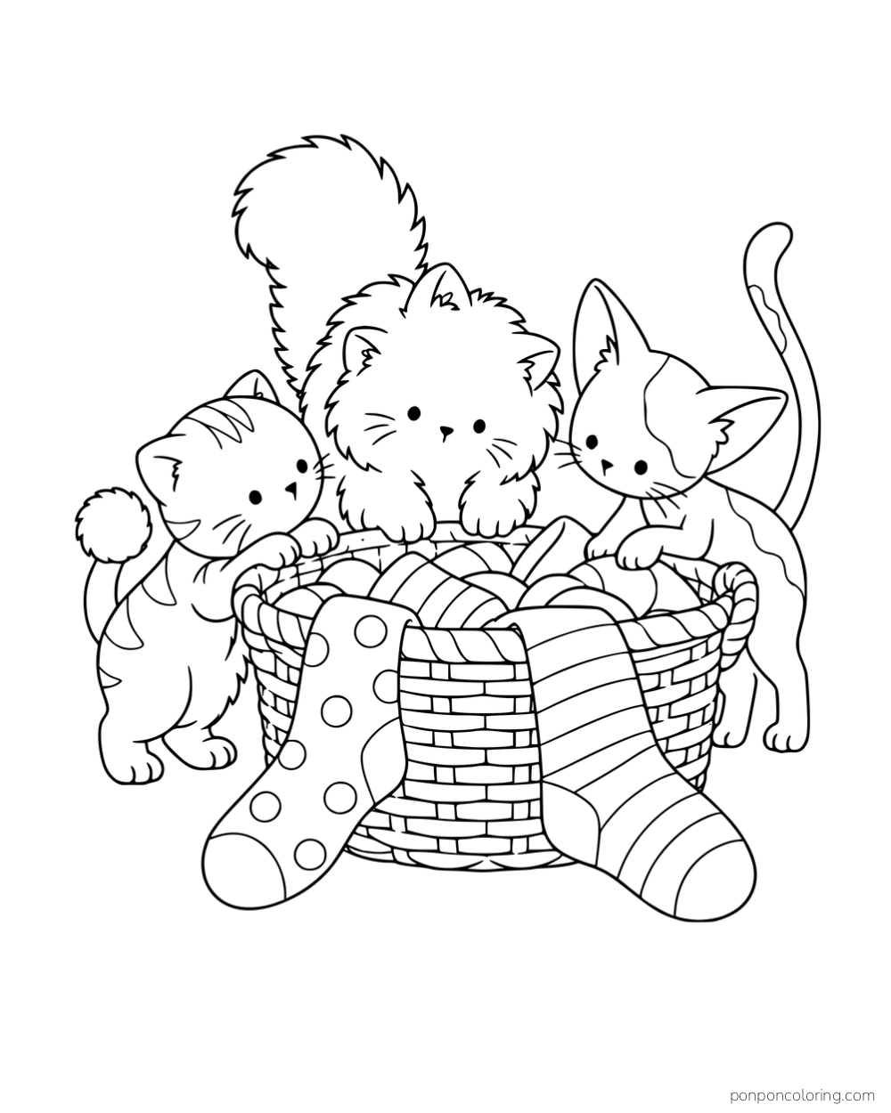 Three kittens with different tails exploring a basket with socks draped over the rim.