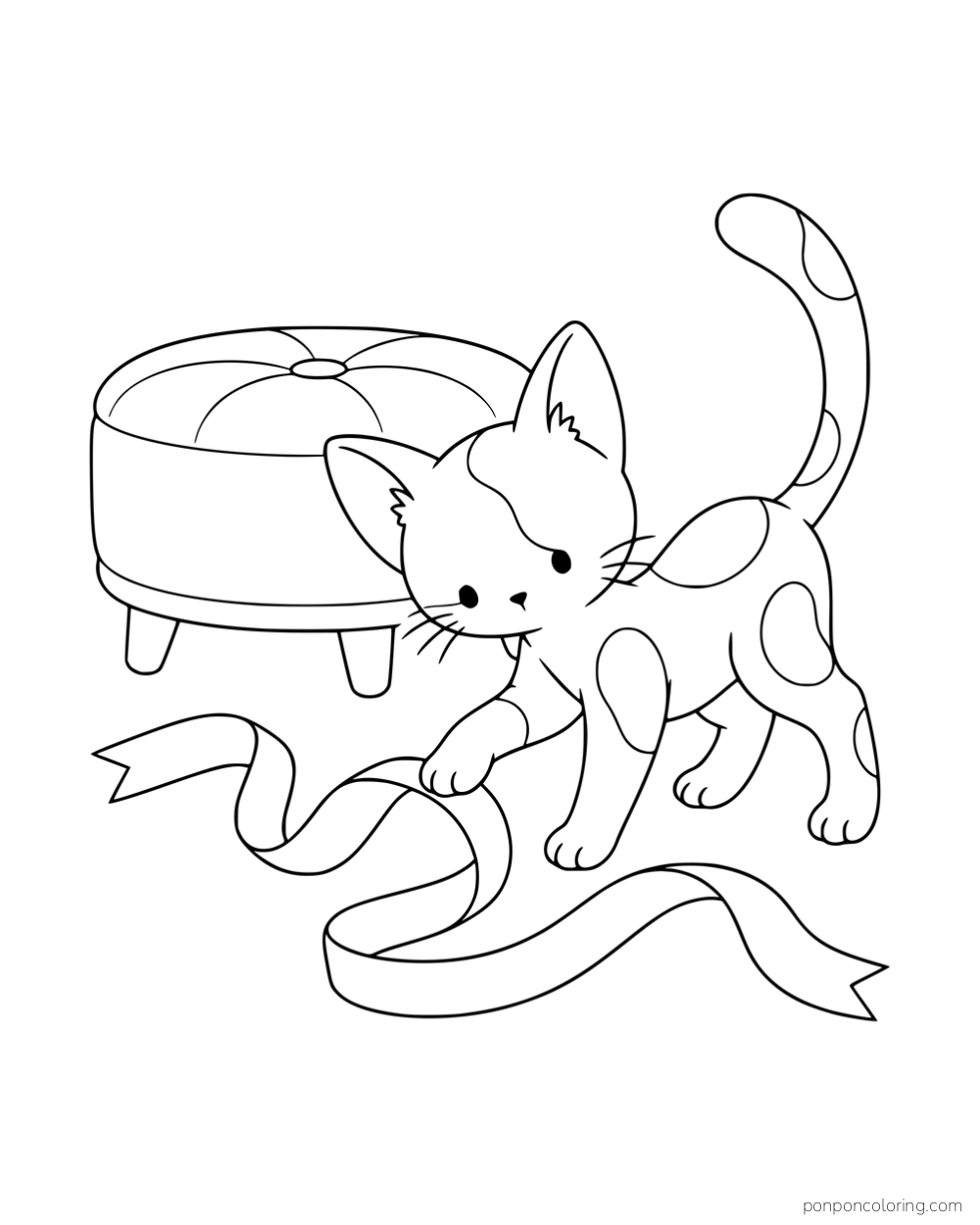 A large-eared kitten with outlined coat patches playing with a ribbon beside a round footstool.