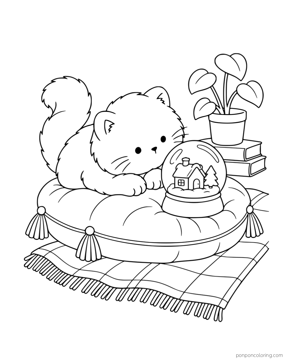 A round-faced kitten looking at a snow globe on a cushion beside books and a plant.