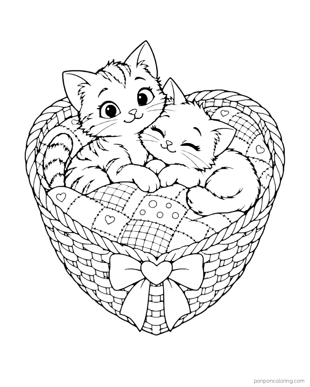 Two kittens cuddle in a heart-shaped wicker basket beneath a patchwork blanket.