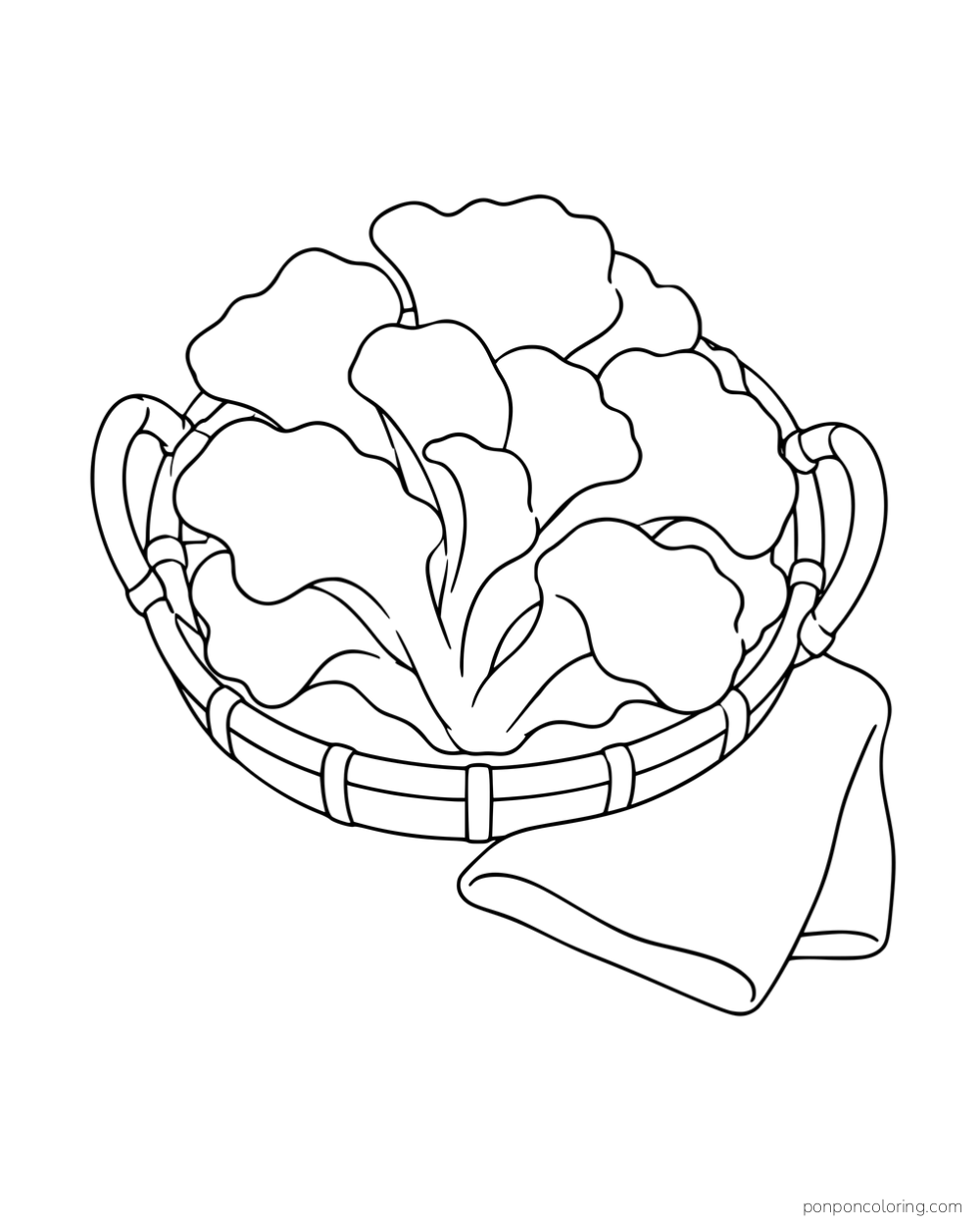 Layered maitake fronds in a shallow handled basket beside a folded cloth.