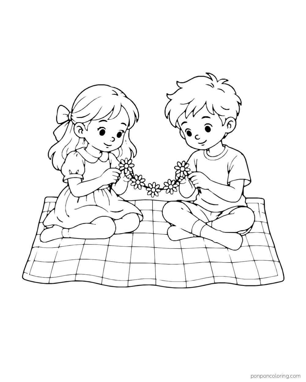 Two children sit on a checked blanket and make a daisy chain together.