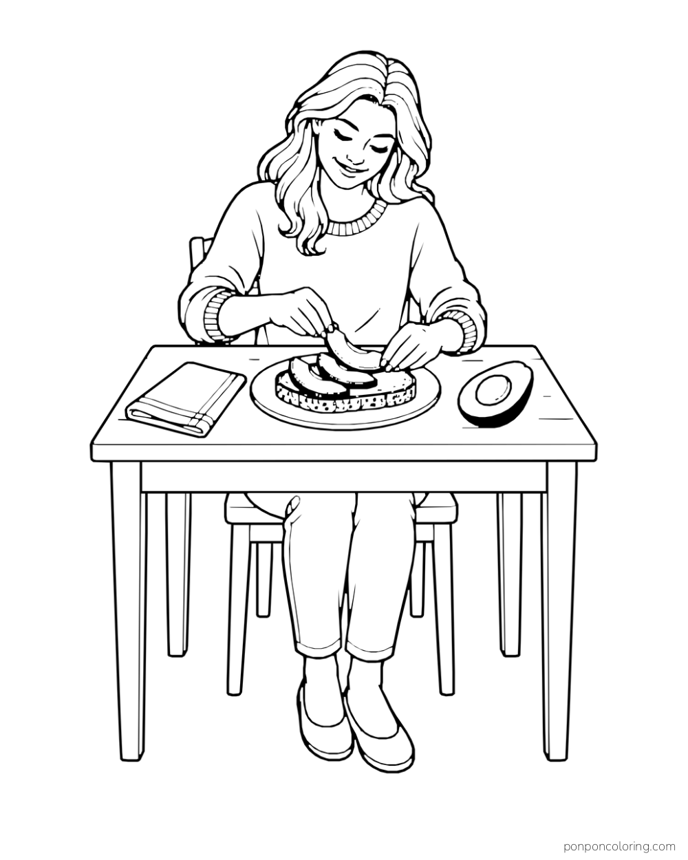 An adult cook arranges three avocado slices on toast at a table beside one avocado half.