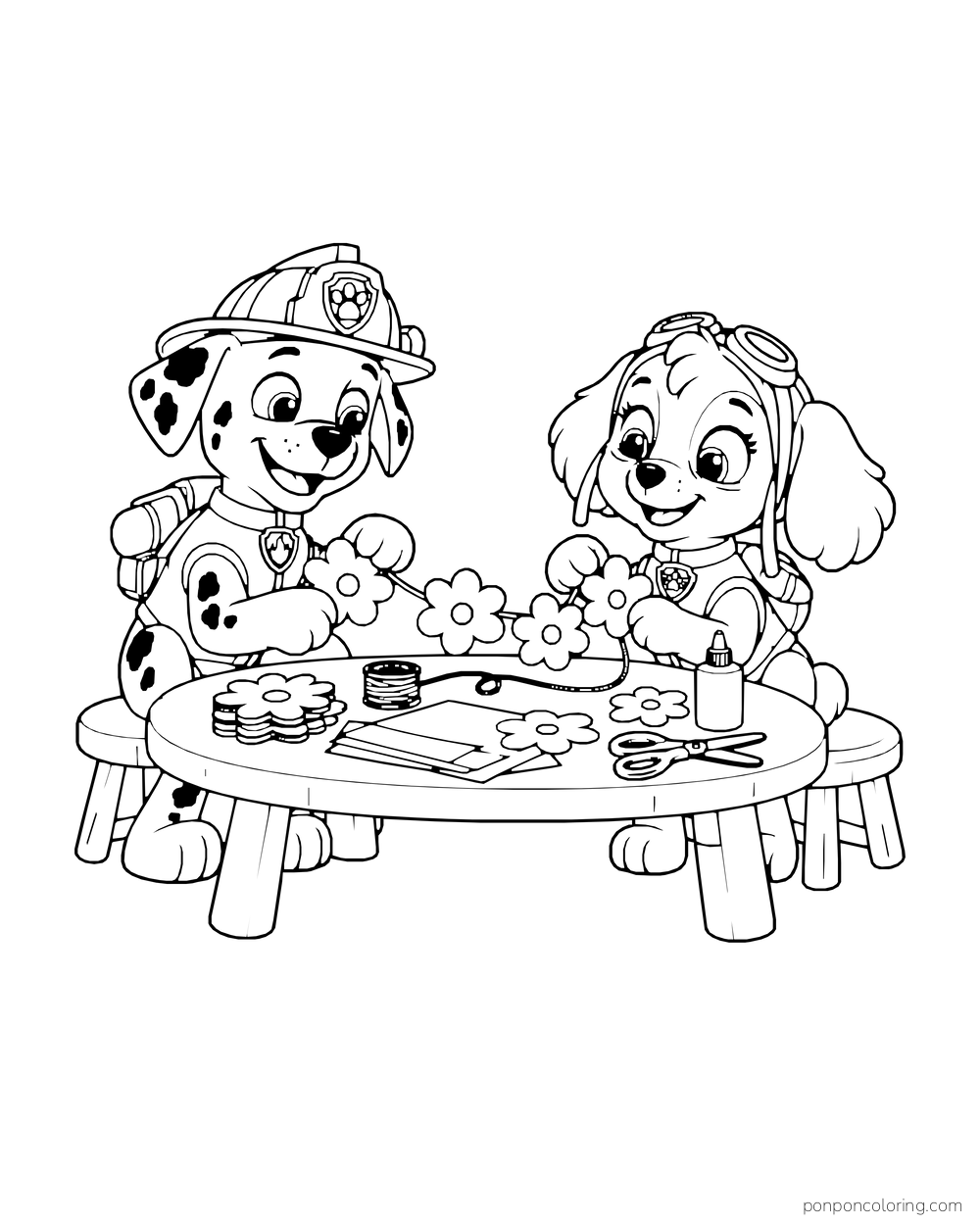 Marshall and Skye make a paper flower garland at a craft table with scissors and glue.